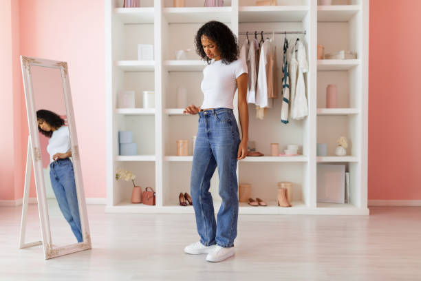 istock Sad latin woman fitting new jeans 2166927769