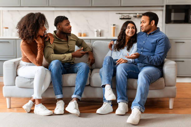 istock Friends talking and relaxing on a sofa 2166928219