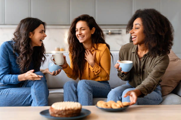 istock Women enjoy conversation and pastries at home 2166928271