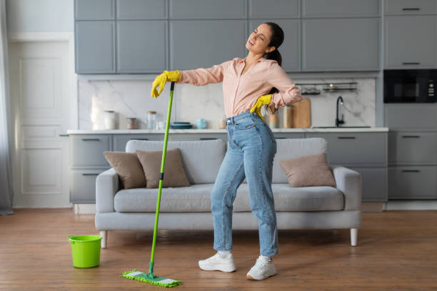 istock Tired woman taking a break from mopping the floor 2166928681