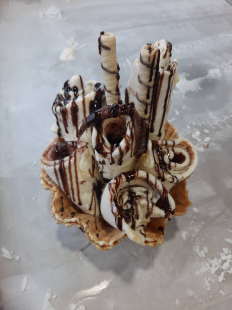 istock ice cream and chocolate syrup topping 2166929020