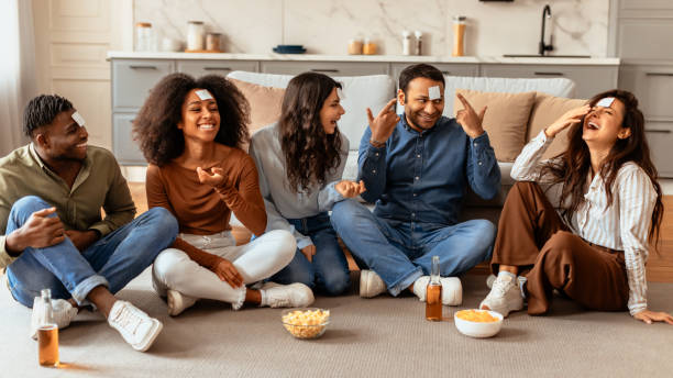 istock Laughing friends having a casual conversation at home 2166929069