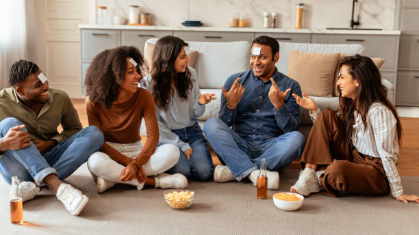 istock Group of friends playing a guess game 2166929083