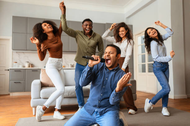 istock Friends singing and performing with energy at home 2166929085