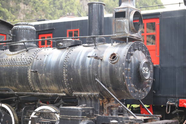 San Juan County, Colorado, USA - July 12, 2021: View of the Animas River and the Durango & Silverton Narrow Gauge Railroad train as seen from a passenger’s perspective out the window of a train car.