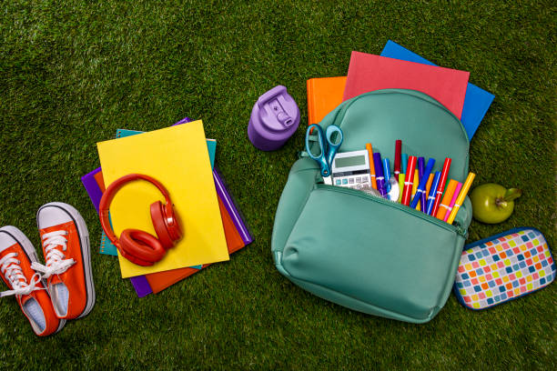 istock Back to School Backpack with Supplies on Grass 2166932361