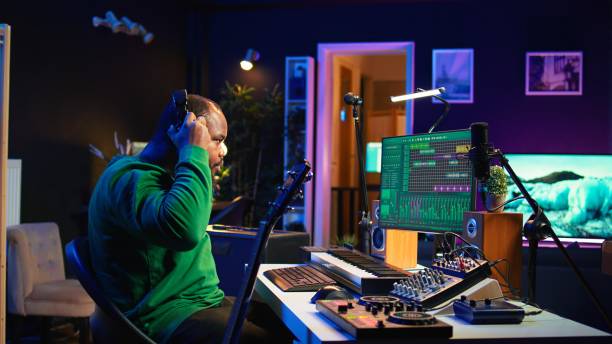 istock Producer creating a track by playing acoustic guitar in home studio 2166933648