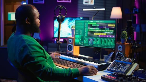 istock Artist playing electronic piano keyboard notes and recording audio files 2166933759