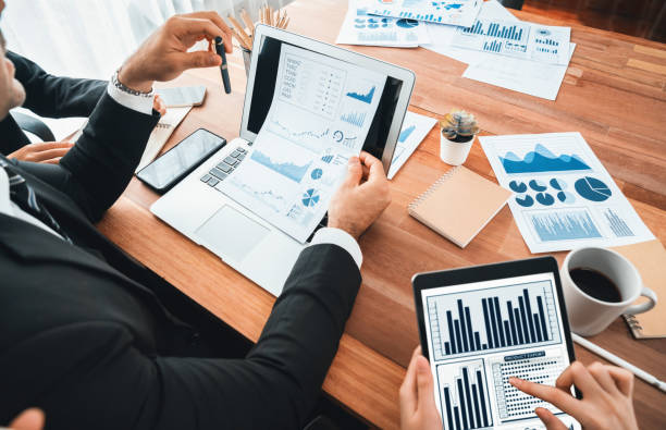 istock Group of business analyst team analyzing financial data report. Habiliment 2166937236
