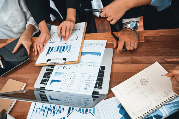 istock Group of business analyst team analyzing financial data report. Habiliment 2166938778