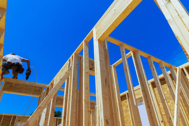 istock Working with an air nail hammer, framing contractor nails a wooden beam using pneumatic nail hammer 2166939915
