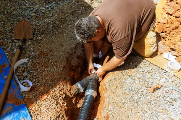 istock Assembling drainage perforated flexible pipe for draining rainwater in a trench 2166939919