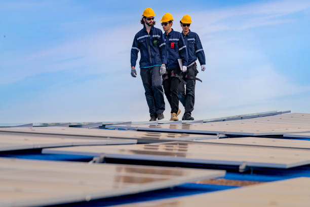 istock engineer man inspects construction of solar cell panel or photovoltaic cell by electronic device. Industrial Renewable energy of green power. factory worker working on tower roof. 2166943732