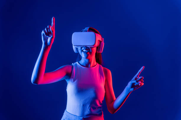 istock Elegant female connect metaverse use finger point virtual object. Hallucination. 2166943742