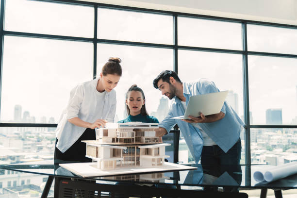 istock Skilled architect holding laptop while present idea to engineer team. Tracery. 2166946917