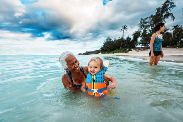 istock Multigenerational family plays in the ocean while on vacation 2166947421