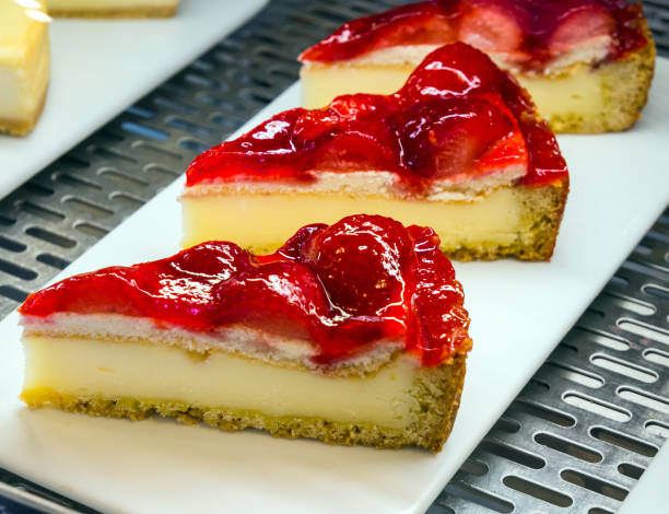 istock Strawberry cheesecake on a cafe showcase 2166947510