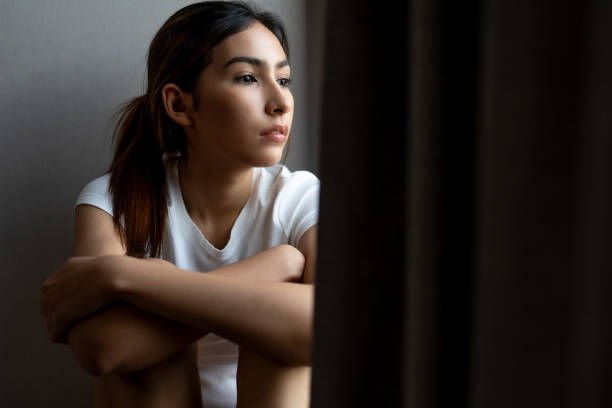 istock woman feeling sad Suffering from depression 2166951050