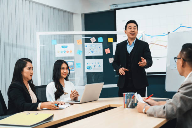 istock Businessmen present financial project for managers' approval. Intellectual. 2166952085