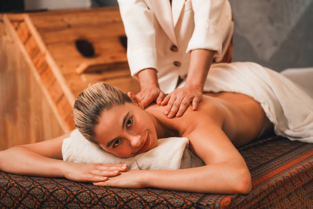 istock A pretty girl having a massage while looking at camera at sauna. Tranquility. 2166953110