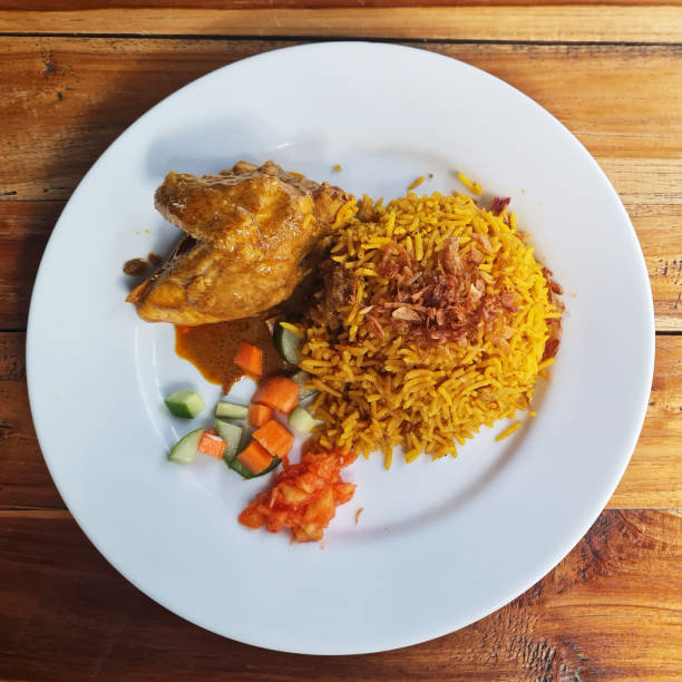 istock Nasi Kebuli with  kari ayam or chicken curry. 2166954213