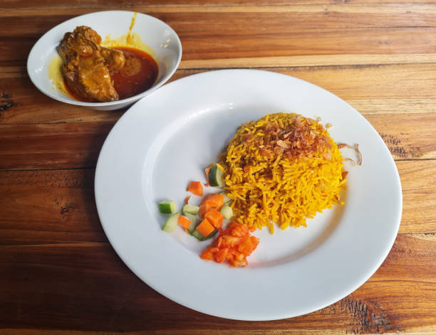 istock Nasi Kebuli with  kari ayam or chicken curry. 2166954227