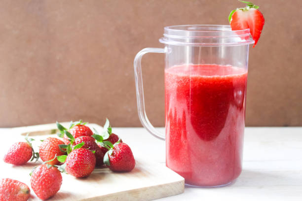 istock strawberry smoothie with strawberries 2166956372