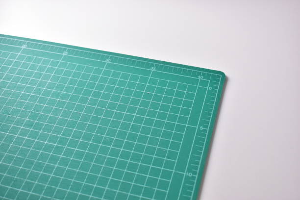 istock green cutting mat board on white background with line and scale measure guide pattern for object art design, tool equipment of diy craft work 2166956941