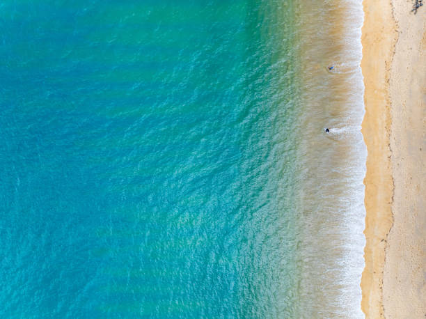 istock Beautiful sea beach and waves texture in sunny summer day background 2166958285