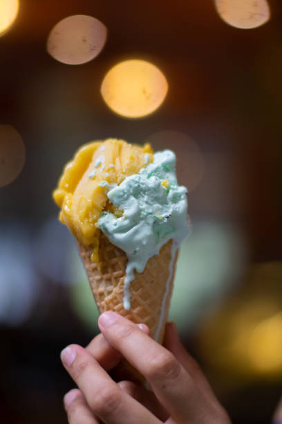 istock Person holding cone of ice cream 2166958392