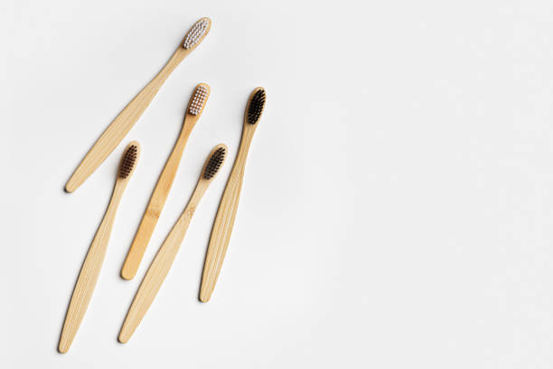 istock Top view of eco-friendly bamboo toothbrushes arranged on grey white background, emphasizing sustainability and minimalism, Natural organic bathroom beauty product concept, dental hygiene, flat lay 2166960864