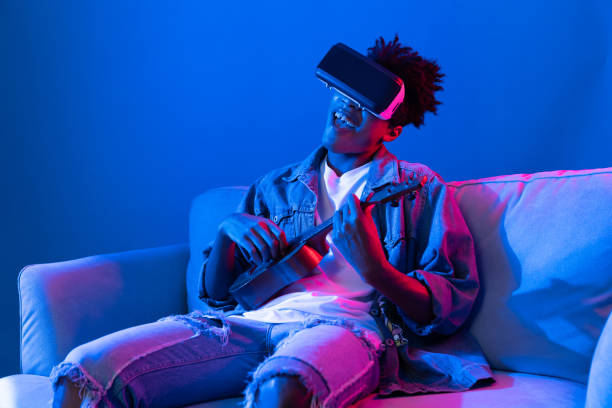 istock African singer using through VR enjoy singing with playing guitar. Contrivance. 2166961358