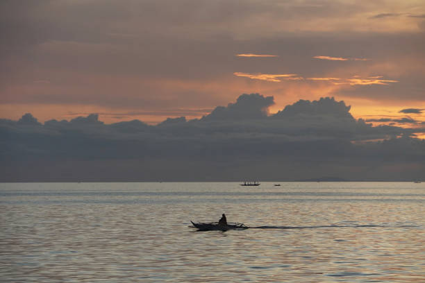 istock Boats in the sea during sunset. 2166965140