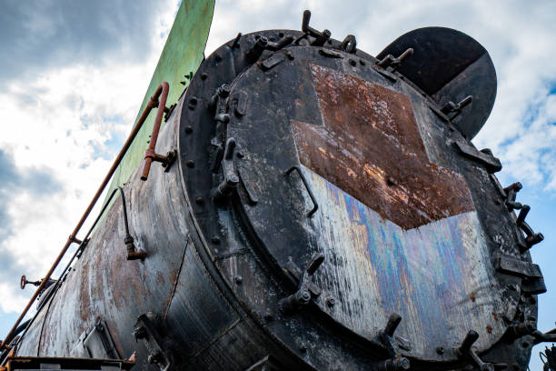 istock Details of an old rusty steam train under a cloudy sky 2166967228