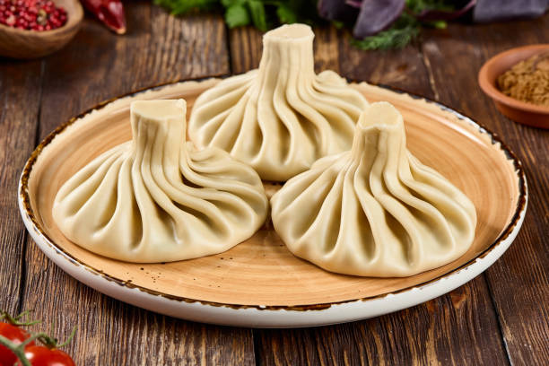 istock Authentic Georgian Khinkali Dumplings on Rustic Plate 2166968900