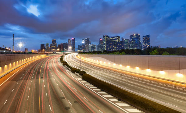 istock Singapore skyline at night with traffic 2166970427