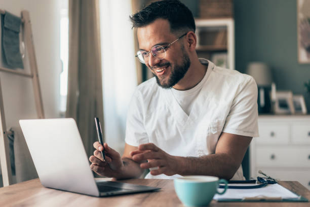 istock Doctor speaks with patient using laptop online 2166971504