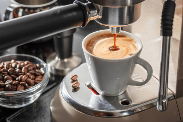 istock Automatic coffee machine. Pouring coffee into the coffee cup closeup. 2166971960