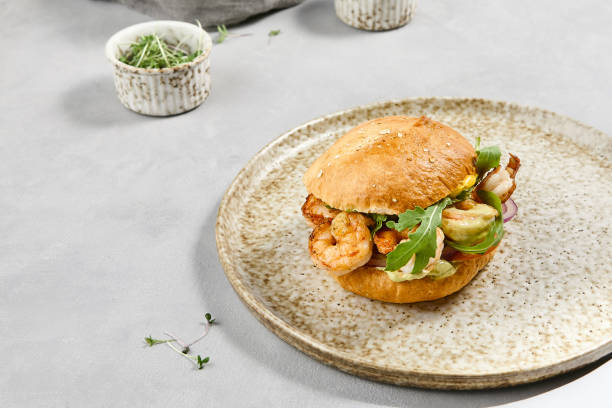 istock Gourmet Shrimp Burger with Guacamole on Artisan Bun 2166972525