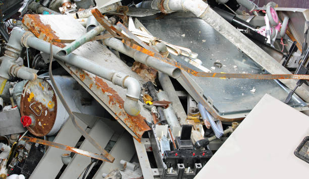 istock Scrap metal and twisted sheets in a recycling center container to protect environment 2166973644