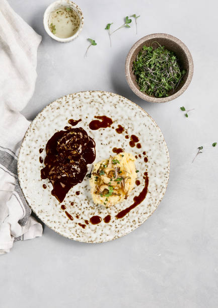 Elegant Plated Beef Cheeks with Demi-Glace Sauce and Creamy Mashed Potatoes