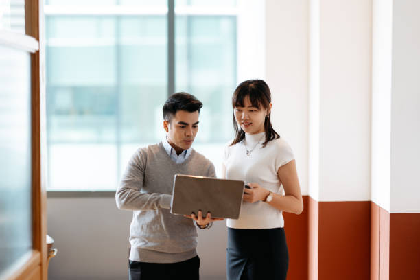 istock Two business people discuss investment project working and planning strategy. 2166974958