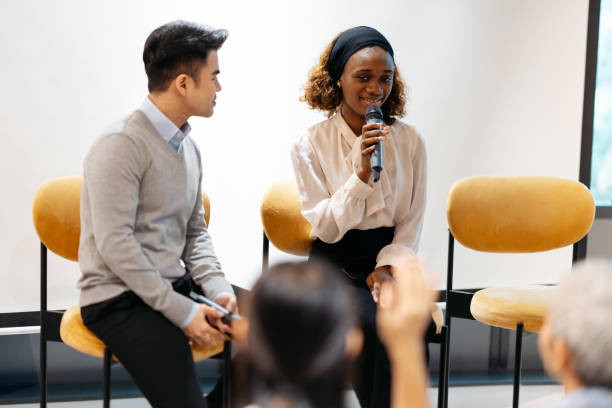 istock Participant raise hands during business conference sharing session 2166975073