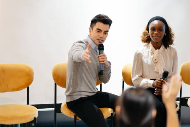 istock Participant raise hands during business conference sharing session 2166975114