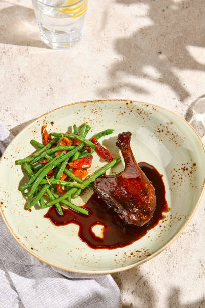 istock Braised Beef Cheek with Mashed Potatoes and Fresh Herb Mix on Rustic Plate 2166977414