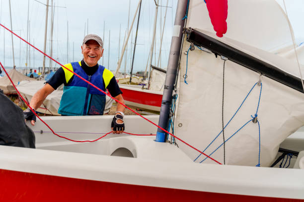 istock Senior man Preparing his boat for a sailing race 2166978087