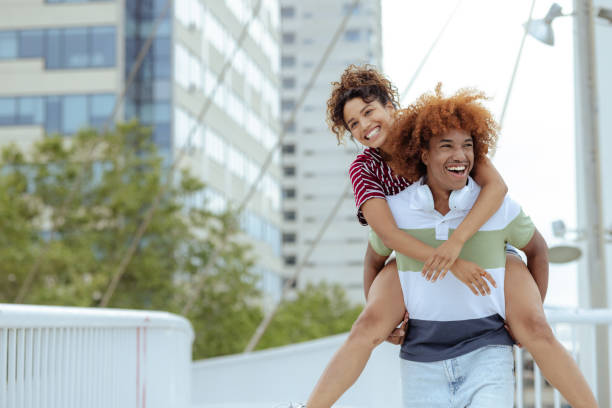 istock Playful young couple having fun during summer day 2166978701