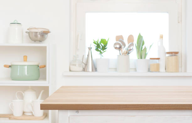istock Blank wooden table top part in blurred kitchen interior background 2166980154