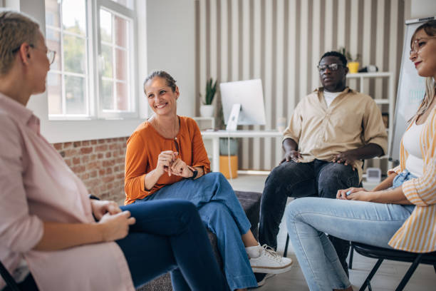 istock Small group discussion seated in modern bright office 2166987133
