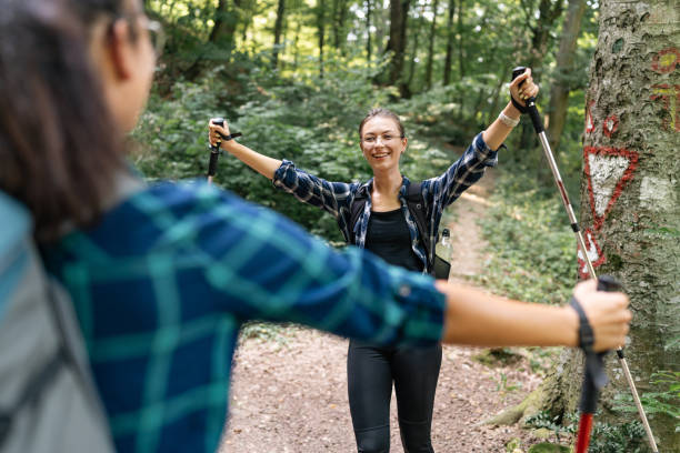 istock Happy hiker spreading arms in the forest smiling. 2166988721